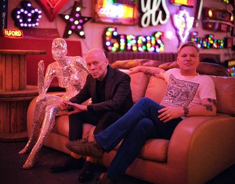 Photo of Erasure on a sofa to promote new tour