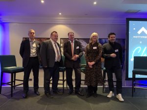 Leader of NCC Cllr Mellen and other guest speakers, Lorraine Baggs, Richard Watson, and Greg Nugent on stage after their discussion.