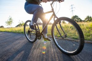 Wheels of bicycle with someone cycling