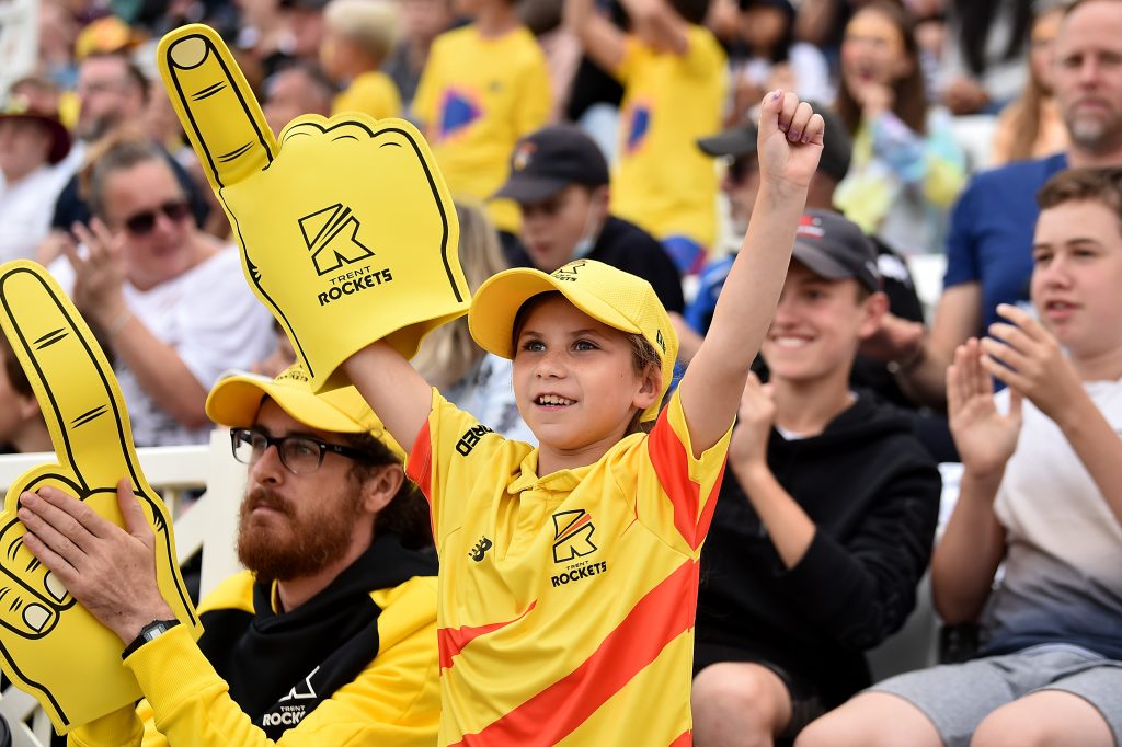 Young girl in the crowd at trent bridge cheering on the Tret Rockets in the Hundred with big foam finger.