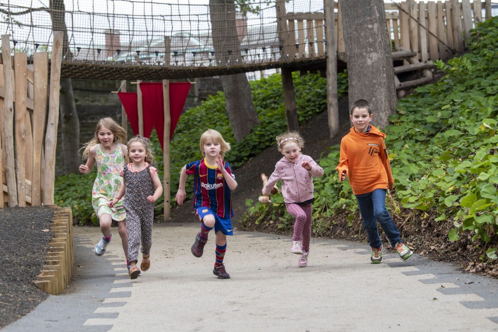 children playing on adventure playground