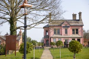 Picture of Vale house in the background with old street lamp in the foreground of the shot