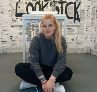 Artist Chloe with her work