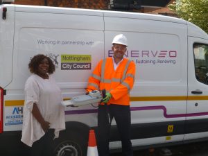 Councillor Audra Wynter with a technician at the first installation of the LEDs
