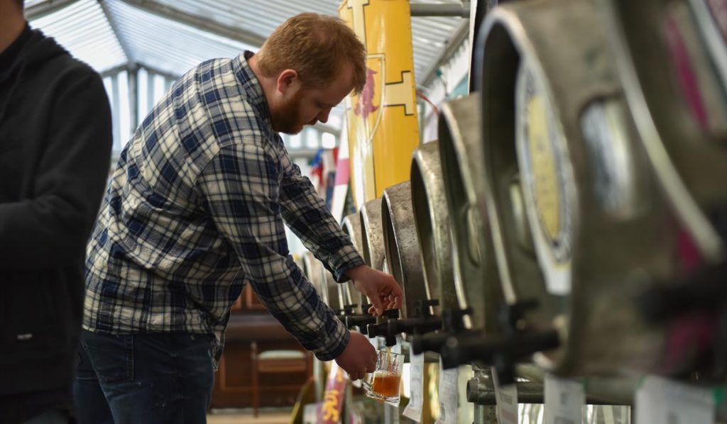 Man pouring beer at the Robin Hood Beer and Cider Festival