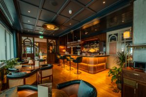 Image of the bar and some tables at the new Cleaver and Wake Restaurant/bar