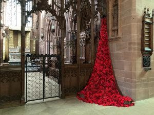 knitted poppys cascading down from the church ceiling