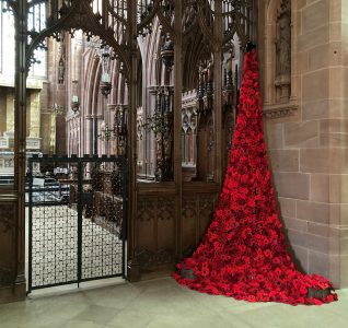 knitted poppys cascading down from the church ceiling