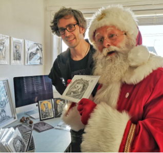 Santa Jolly with local artist Marcus with their artwork