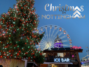 Lit up Christmas tree, chalet bar, big wheel and Nottingham Council House.