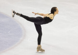 Ice skater skating on one foot at the national ice centre