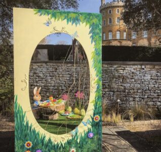 An Easter scene with a small rabbit figure having tea.