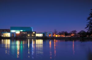 Lakeside Arts at night across the water