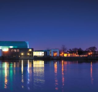 Lakeside Arts at night across the water