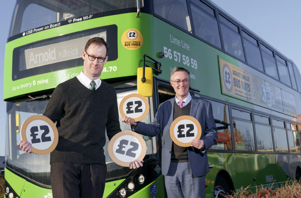 Picture of Gedling MP Tom Rendall and NCT Managing Director, David Astill in front of a Nottingham bus with signs saying £2.