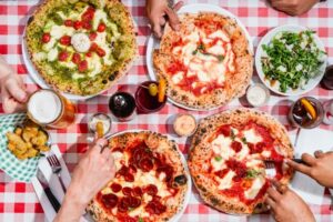 A selection of Pizzas laid out on the table at Pizza Pilgrims.