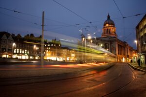 Nottingham at night with the council house in the background.