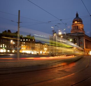 Nottingham at night with the council house in the background.