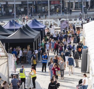 areal shot of the ay up market in old market square.
