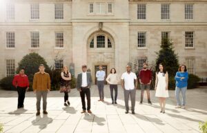 People Standing outside the University of Nottingham to promote the jobs fair they're hosting.