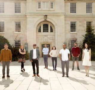 People Standing outside the University of Nottingham to promote the jobs fair they're hosting.