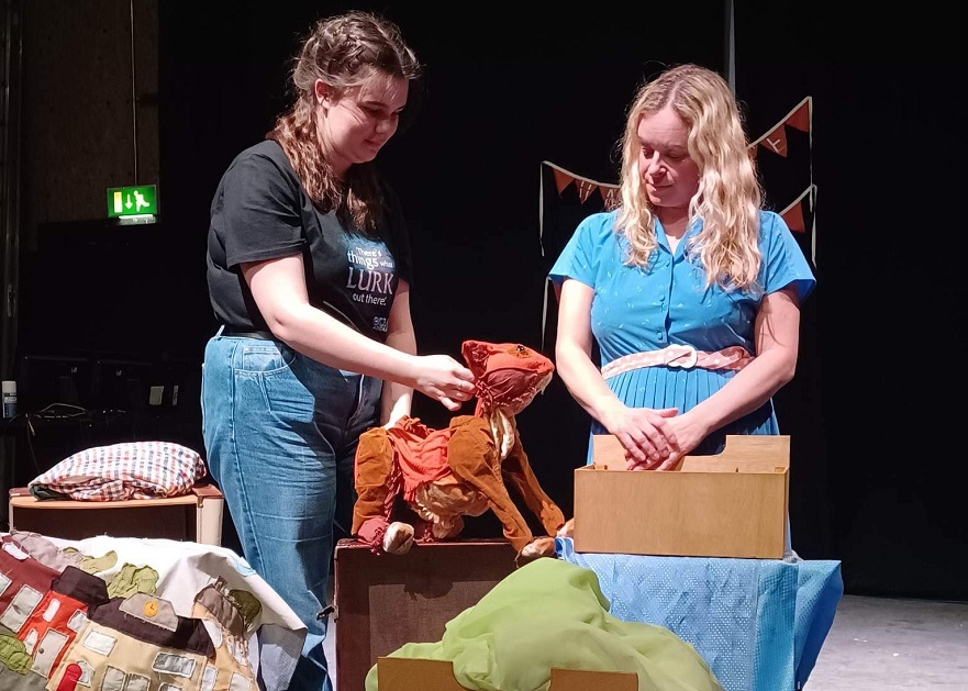 Charlotte and Suzy from Handmade theatre on stage with George the Cat