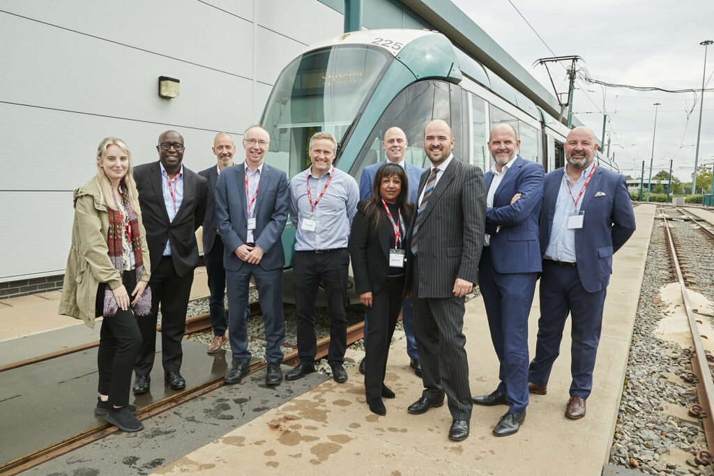 Minister Richard Holden, stood with councillors and officers from Nottingham city council.