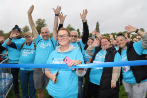 Morgan Pike cuts the ribbon for her beloved Bill