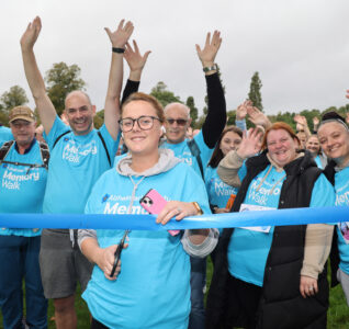 Morgan Pike cuts the ribbon for her beloved Bill