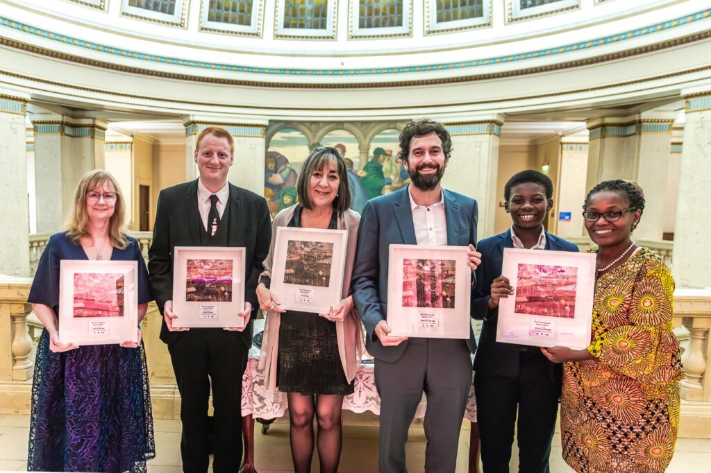 A picture of all the award recepitents posing with their awards in Nottingham's Council House