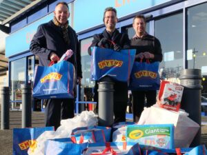 Three of Mansfield's councillors stood with bags of donations and toys.