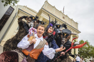 People in Panto costume outside the Theatre Royal in Nottingham