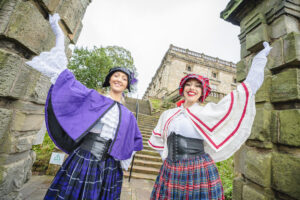 Two ladies dressed in victorian clothes outside of Nottingham Castle