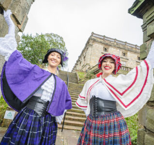 Two ladies dressed in victorian clothes outside of Nottingham Castle