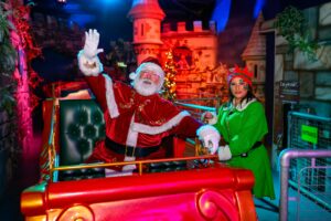Santa with an elf at sundown adventure land