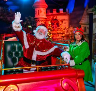 Santa with an elf at sundown adventure land