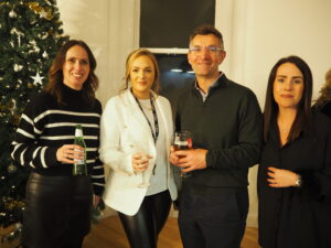 Cubo launch event at standard court, pictured are 4 people all looking and smiling for the camera.