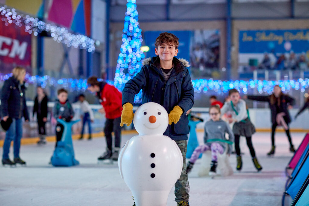 Boy skating on the ice.