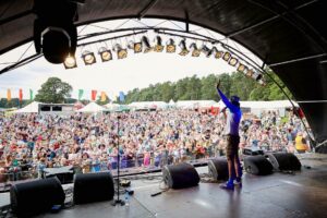 Andy Day from CBeebies on stage at a Glow Worm Festival of past years.