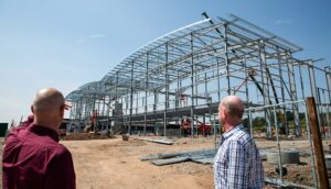 Development Director of Clowes, James Richards and Director of FHP, Tim Gilbertson check on progress as the building flies up.