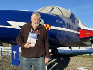 The author, Colin Savill is pictured with his new book in front of his recently repainted Hawke Hunter T7 aircraft at the museum’s site on part of the former RAF Winthorpe Airfield site.