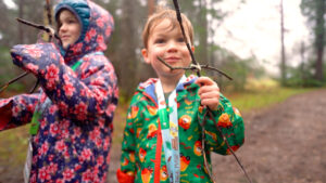 Photo of young child with a stick