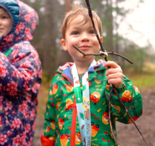 Photo of young child with a stick
