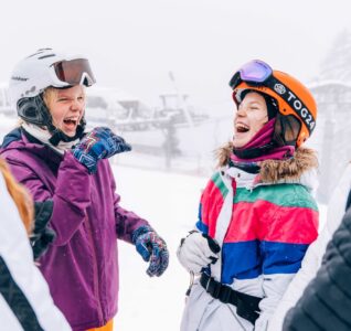 children in the snow and ski